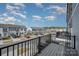 Balcony view of a neighborhood showcasing townhomes and vehicles at 13047 Gadwal Pintail Dr, Charlotte, NC 28262