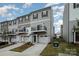 Exterior elevation of townhomes, featuring individual balconies and front-entry garages at 13047 Gadwal Pintail Dr, Charlotte, NC 28262