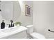 Modern powder room with a pedestal sink and toilet at 2304 Catalina Ave, Charlotte, NC 28206