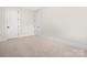 Spacious bedroom with neutral walls and carpeted floors at 2304 Catalina Ave, Charlotte, NC 28206