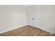 Empty bedroom with hardwood floors and double doors at 2304 Catalina Ave, Charlotte, NC 28206