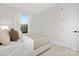 Light and airy bedroom with a comfortable bed at 2304 Catalina Ave, Charlotte, NC 28206