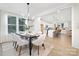 Elegant dining room with a dark wood table and six light beige chairs at 2304 Catalina Ave, Charlotte, NC 28206