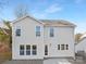 Two-story house with light-grey siding, multiple windows, and a patio at 2304 Catalina Ave, Charlotte, NC 28206