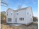 Two-story house rear view, light-grey siding, windows and patio at 2304 Catalina Ave, Charlotte, NC 28206