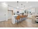 Modern kitchen with white cabinets, breakfast bar, and stainless steel appliances at 2304 Catalina Ave, Charlotte, NC 28206