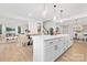 Modern kitchen with white cabinets, a large island, and stainless steel appliances at 2304 Catalina Ave, Charlotte, NC 28206