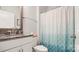 Clean bathroom with granite vanity and teal shower curtain at 3878 Fairlady Ln, Fort Mill, SC 29707