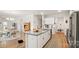 Modern kitchen with granite island, white cabinets, and stainless steel appliances at 3878 Fairlady Ln, Fort Mill, SC 29707