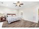 Bright bedroom features a ceiling fan, and wood-look floors at 6296 Raven Rock Dr # 725, Denver, NC 28037