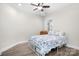 Bedroom with light walls, white trim, and wood-look floors at 6296 Raven Rock Dr # 725, Denver, NC 28037