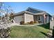 Beautiful home showcasing a brick facade, well-manicured lawn, and an American flag out front at 6296 Raven Rock Dr # 725, Denver, NC 28037