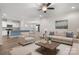 Spacious living room with a ceiling fan, recessed lighting, and open floor plan to the kitchen at 6296 Raven Rock Dr # 725, Denver, NC 28037