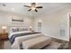 Relaxing main bedroom featuring a ceiling fan, ensuite bath, and neutral décor at 6296 Raven Rock Dr # 725, Denver, NC 28037