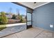 Screened-in patio with a view of the backyard and blue siding at 6296 Raven Rock Dr # 725, Denver, NC 28037