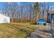 Wooded backyard with storage shed and fence at 797 Chief Thomas Rd, Harmony, NC 28634