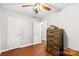 Bright bedroom featuring wood floors, double closets, and dresser at 797 Chief Thomas Rd, Harmony, NC 28634