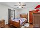 Bedroom with wood floors, a double bed, and wood dresser at 797 Chief Thomas Rd, Harmony, NC 28634