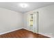 Simple bedroom with wood floors and a window at 797 Chief Thomas Rd, Harmony, NC 28634