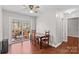 Bright dining area with wood flooring and access to deck at 797 Chief Thomas Rd, Harmony, NC 28634