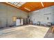 Large garage with concrete floor and shelving at 797 Chief Thomas Rd, Harmony, NC 28634