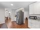 Modern kitchen features stainless steel appliances and white cabinets at 797 Chief Thomas Rd, Harmony, NC 28634