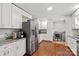 Modern kitchen with white cabinets and stainless steel appliances at 797 Chief Thomas Rd, Harmony, NC 28634