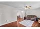 Living room with hardwood floors and brown couch at 797 Chief Thomas Rd, Harmony, NC 28634