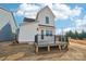 New home with a modern backyard deck, white siding, and a door and windows at 817 Terra Dr, Tega Cay, SC 29708