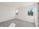 Bright bedroom with plush carpeting, two windows, and neutral walls at 817 Terra Dr, Tega Cay, SC 29708