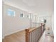 Upstairs landing featuring a railing, natural light and beautiful hardwood floors at 817 Terra Dr, Tega Cay, SC 29708