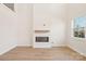 Modern living room with an electric fireplace and a large window for natural light at 817 Terra Dr, Tega Cay, SC 29708