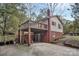 Rear exterior featuring upper deck and lower patio with seating beneath the deck of a single-Gathering home at 914 Wyke Rd, Shelby, NC 28150