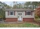 Charming single-Gathering home featuring vinyl siding, red shutters, and a welcoming front entrance with a decorative wreath at 914 Wyke Rd, Shelby, NC 28150