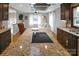 Open concept kitchen with modern appliances flowing into a sunlit living room at 914 Wyke Rd, Shelby, NC 28150