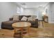 Living room showcasing wood floors, large couch, and lighting at 914 Wyke Rd, Shelby, NC 28150