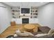 Living room with wood floors, shelving, and a fireplace at 914 Wyke Rd, Shelby, NC 28150