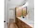 Modern bathroom with light wood cabinets and a quartz countertop at 2443 Myrtle Ave, Gastonia, NC 28052