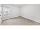 Well-lit bedroom featuring a window and carpeting at 2443 Myrtle Ave, Gastonia, NC 28052