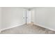 Bright bedroom with carpeted floor and double door closet at 2443 Myrtle Ave, Gastonia, NC 28052