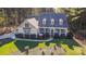 Aerial view of a house showcasing its size, landscaping, and location within a wooded area at 360 Lauren Pines Dr, York, SC 29745