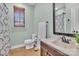 Neutral bathroom with dark wood vanity, mirror and light green walls at 360 Lauren Pines Dr, York, SC 29745