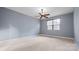 Sunlit bedroom featuring a window and neutral carpeting, offering a tranquil atmosphere at 360 Lauren Pines Dr, York, SC 29745