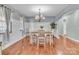 Elegant dining room with modern chandelier, wainscoting, and hardwood flooring at 360 Lauren Pines Dr, York, SC 29745