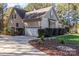 Exterior view of a two-car garage with a paved driveway and landscaping at 360 Lauren Pines Dr, York, SC 29745