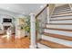 View of the staircase with wood steps and iron balusters, leading to the home's upper level at 360 Lauren Pines Dr, York, SC 29745