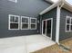 Home's exterior with gray siding, sliding glass door, and patio at 362 Brinkley Dr # 142, Kings Mountain, NC 28086