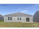 Gray house exterior with sliding glass door and grassy backyard at 404 Brinkley Dr # 141, Kings Mountain, NC 28086