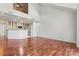 Open kitchen with hardwood floors and stainless steel appliances at 513 N Graham St # 3D, Charlotte, NC 28202