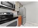 Modern kitchen features stainless steel appliances and granite countertops at 513 N Graham St # 3D, Charlotte, NC 28202